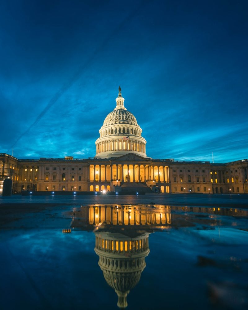 Puddle Reflection Of The Us Capitol At Night