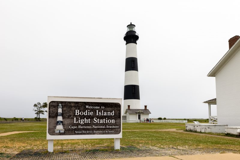 View of the Bodie Island Light Station and sign