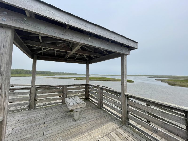 Wooden pavilion at Bodie Island Lighthouse overlooking the marsh