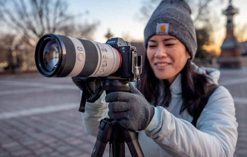 Photographer holding Sony camera