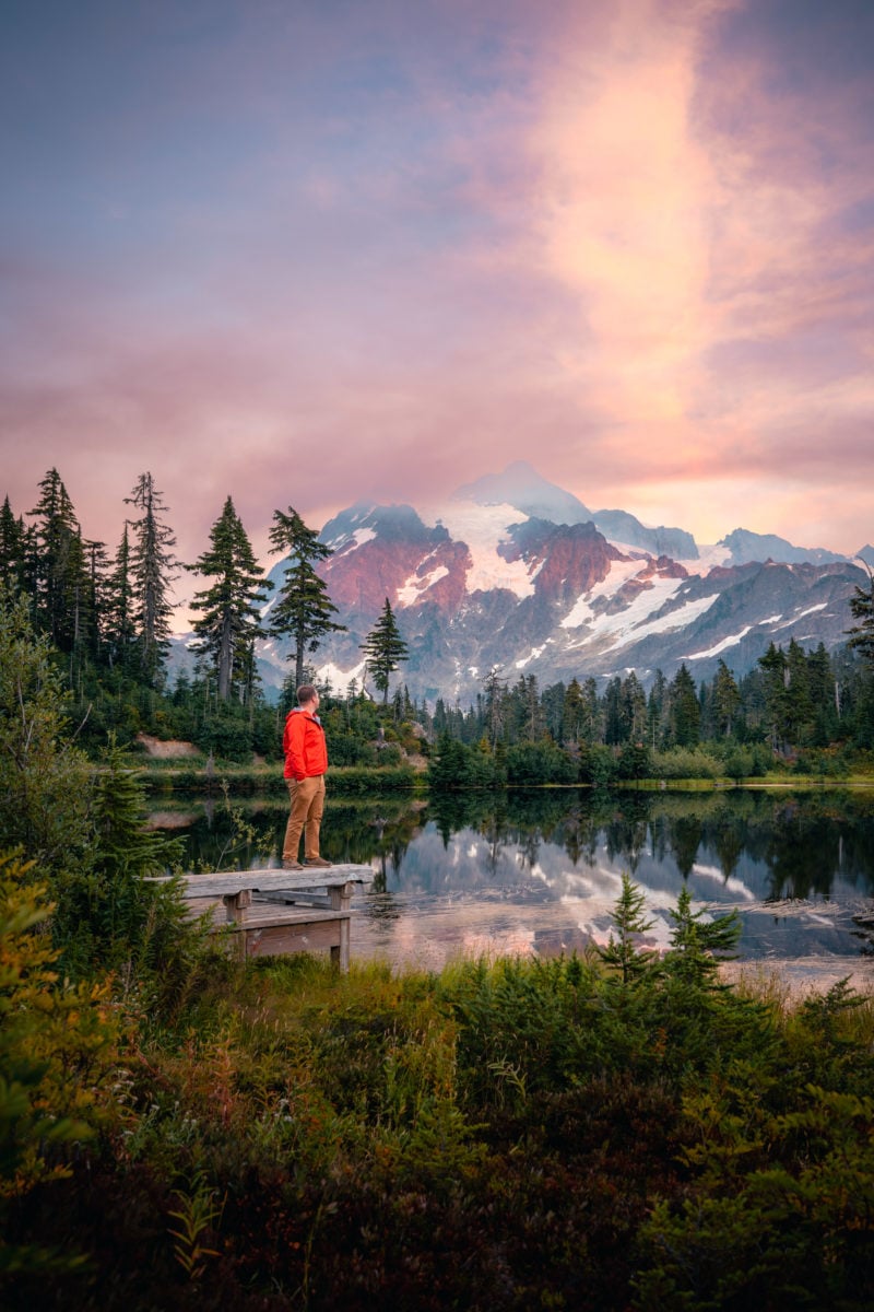 Andy Feliciotti standing in red jacket overlooking Picture Lake in Washington